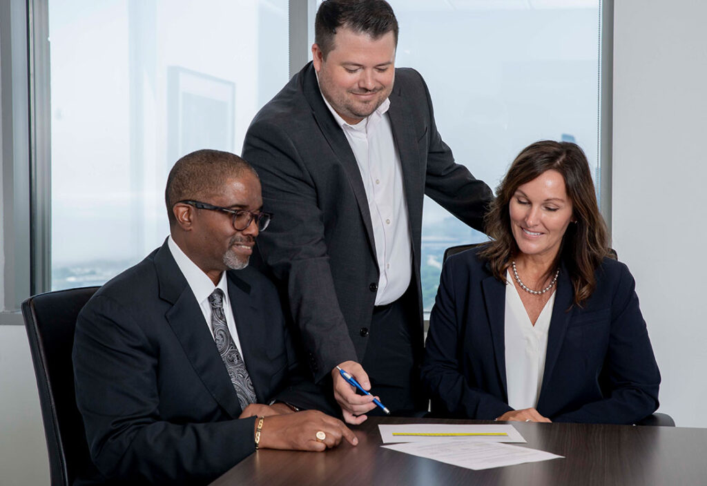 Group of colleagues collaborating at desk